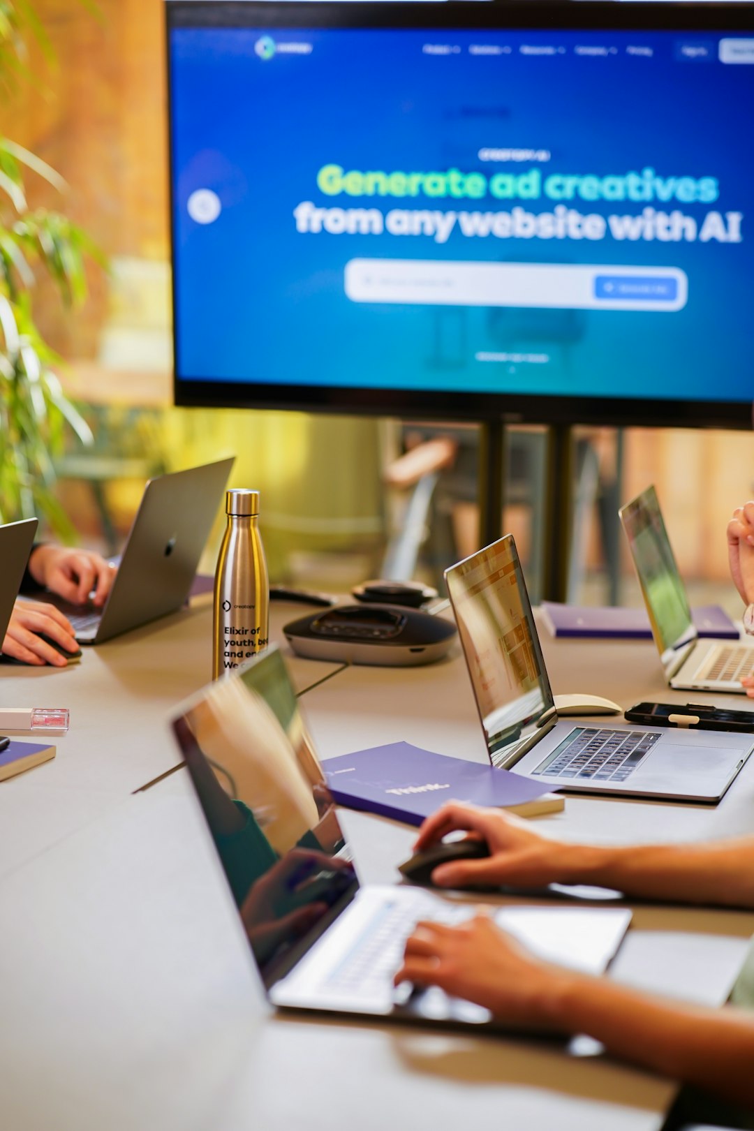 Mastering the First Impression: Your intriguing post title goes here A tech startup is having a marketing meeting with coworkers and their laptops.